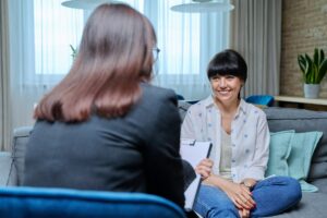 Mature woman at therapy meeting with psychologist